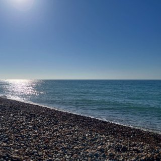 The calm blue water of rocky Brighton beach on a sunny day