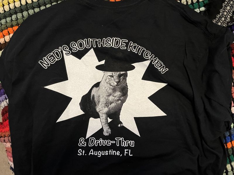 The back of my t-shirt from Ned's, which reads 