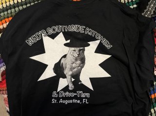 The back of my t-shirt from Ned's, which reads 
